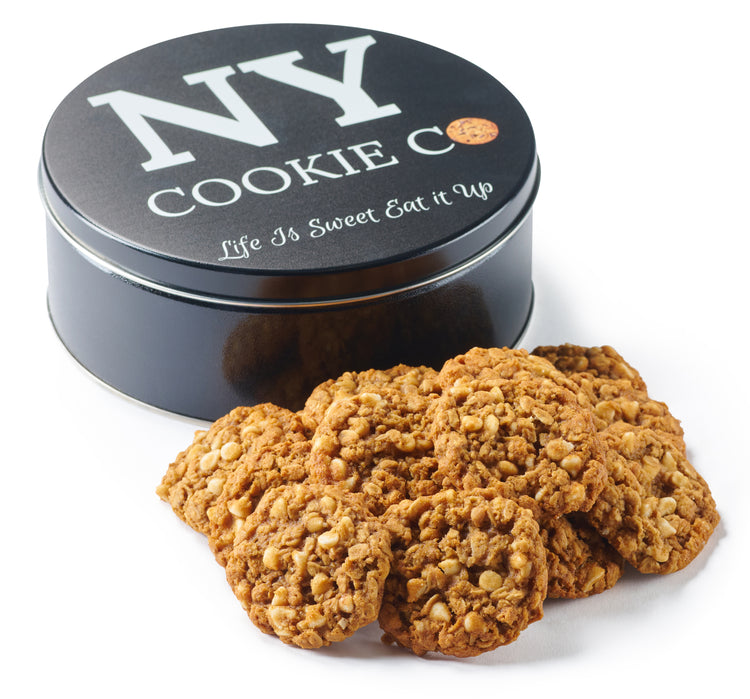 Oatmeal White Chip cookies beside a black NY Cookie Co. tin